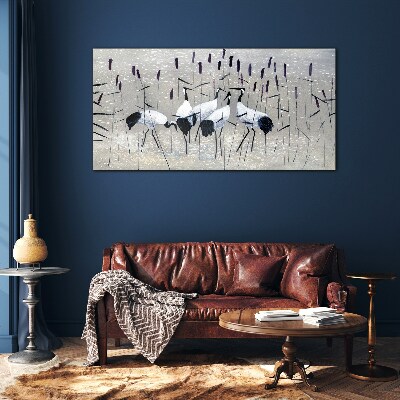 Tableau imprimé sur verre Grues blanches dans les roseaux