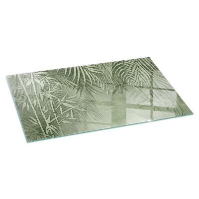 Plaque de sol en verre pour poêle Arrière-plan avec des feuilles tropicales