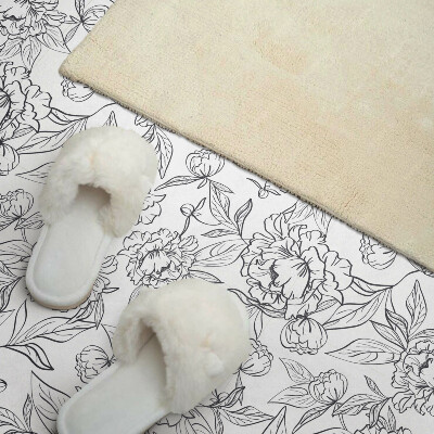 Revêtement mural pvc Un motif de fleurs entourées de feuilles