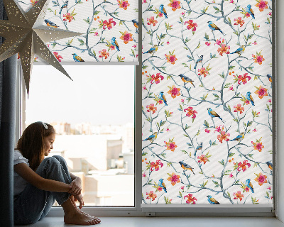 Store enrouleur Un oiseau sur une branche