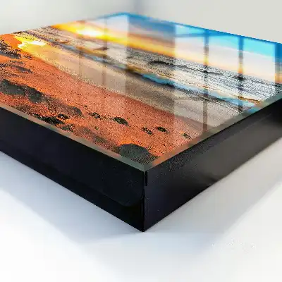 Tableau représentant un coucher de soleil sur la mer avec une plage
