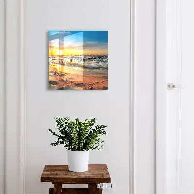 Tableau représentant un coucher de soleil sur la mer avec une plage