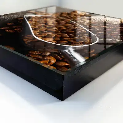 Grains de café dans une louche en métal
