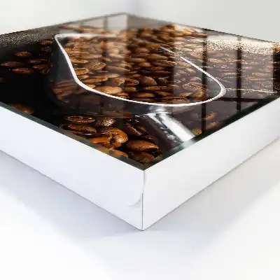 Grains de café dans une louche en métal