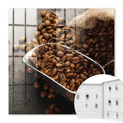 Grains de café dans une louche en métal