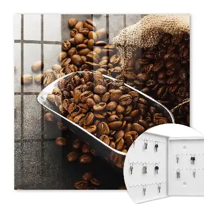 Grains de café dans une louche en métal