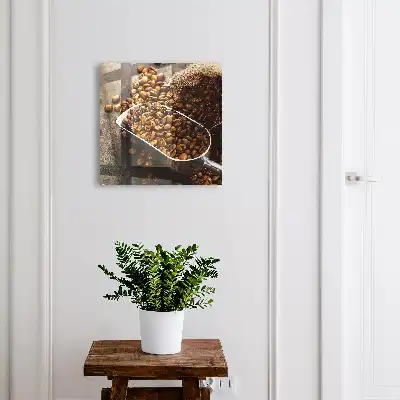 Grains de café dans une louche en métal