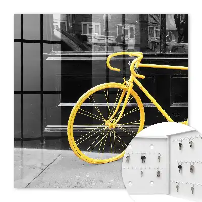 Vélo jaune sur fond noir et blanc