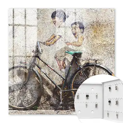 Tableau Des enfants et un vélo sur un vieux mur