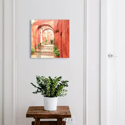 Rue rouge avec des plantes et des escaliers