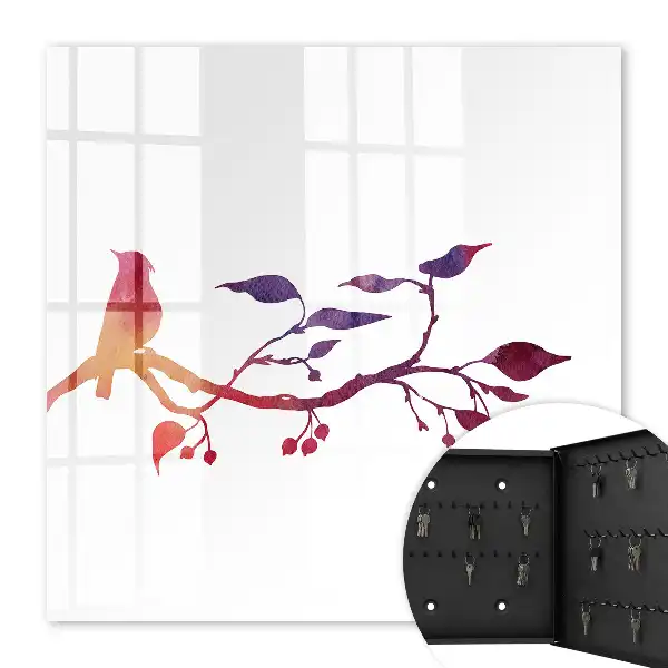 Une branche avec un oiseau aux couleurs rouges et violettes