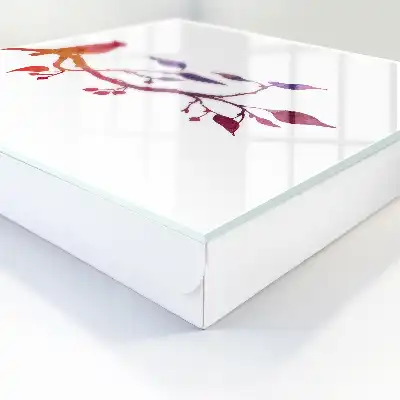 Une branche avec un oiseau aux couleurs rouges et violettes