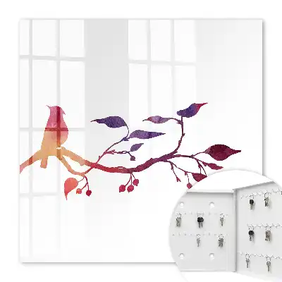 Une branche avec un oiseau aux couleurs rouges et violettes