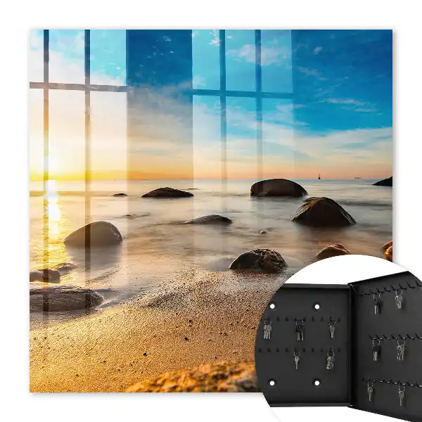 Coucher de soleil sur la mer et les galets
