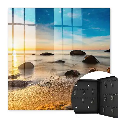 Coucher de soleil sur la mer et les galets
