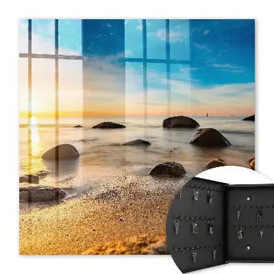 Coucher de soleil sur la mer et les galets