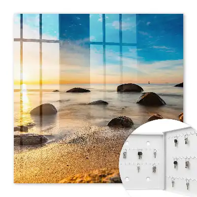Coucher de soleil sur la mer et les galets