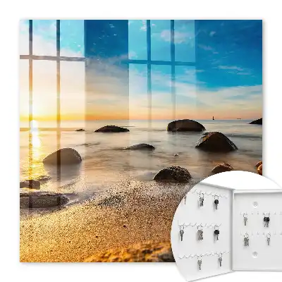 Coucher de soleil sur la mer et les galets