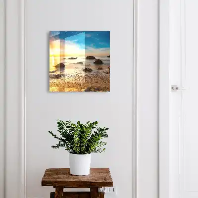 Coucher de soleil sur la mer et les galets