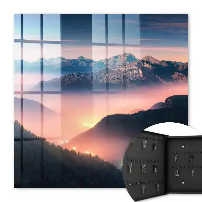 Panorama montagneux avec lumières de la ville