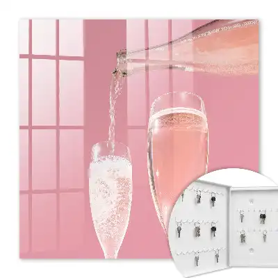 Verres à champagne sur fond rose
