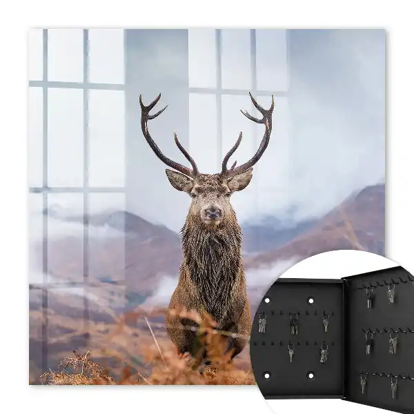 Tableau de cerfs de montagne dans un paysage brumeux