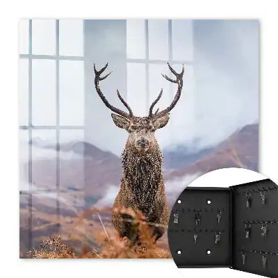 Tableau de cerfs de montagne dans un paysage brumeux