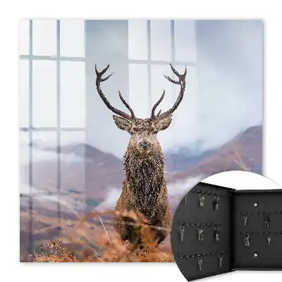 Tableau de cerfs de montagne dans un paysage brumeux