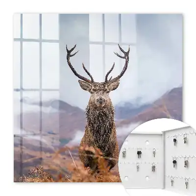 Tableau de cerfs de montagne dans un paysage brumeux