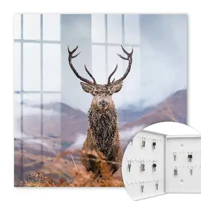 Tableau de cerfs de montagne dans un paysage brumeux