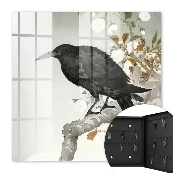 Corbeau noir sur une branche fleurie