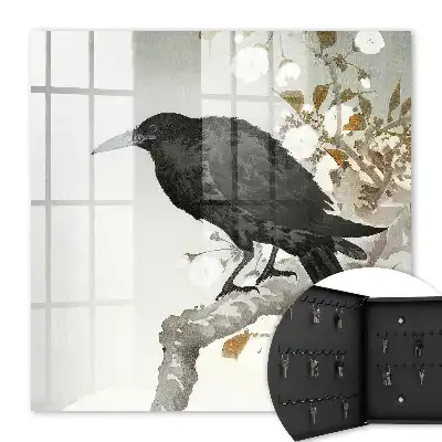 Corbeau noir sur une branche fleurie