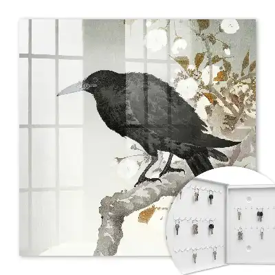 Corbeau noir sur une branche fleurie