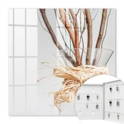 Branches décoratives dans un vase avec ficelle beige