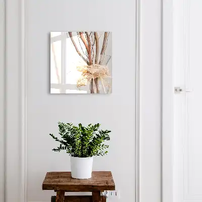 Branches décoratives dans un vase avec ficelle beige